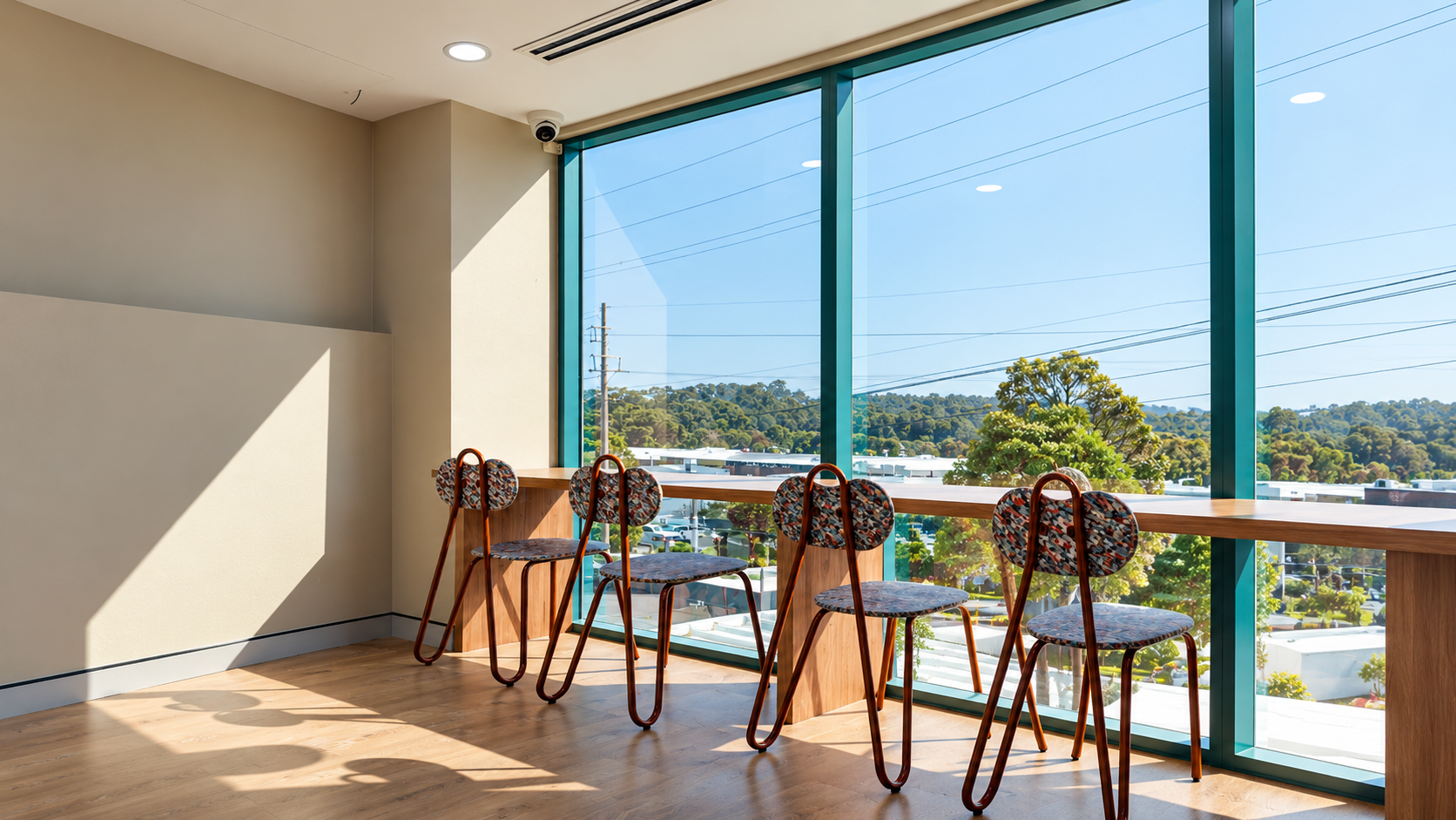 Window bar seating at Local Hubb with timber stools and a leafy Kirrawee outlook